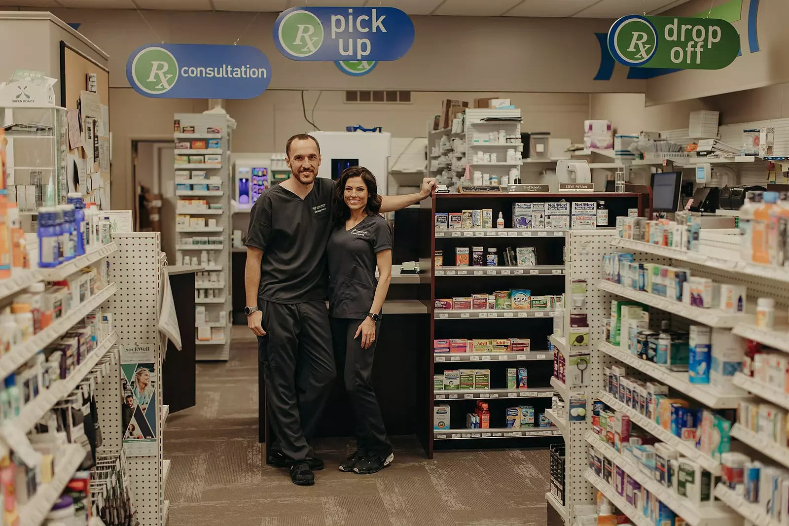 two pharmacists posing for a photo at Washington Drug and Health
