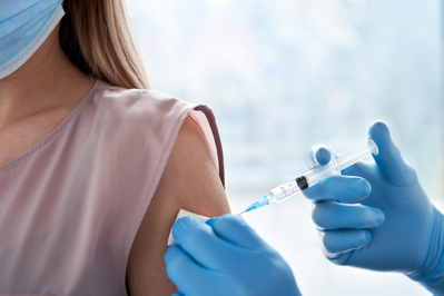pharmacist giving vaccine