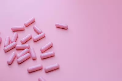 pink pills against pink background