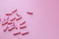 pink pills against pink background