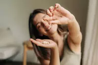 energetic woman taking supplement