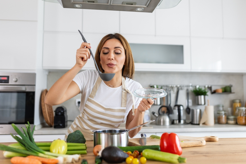 woman cooking with vegetables